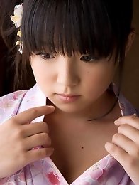 Asian babe shows of massive tits as she takes off her kimono